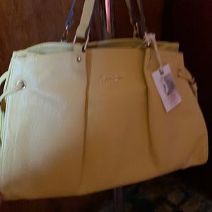 Yellow. Jessica Simpson. Lots of compartments. New w/ tag.